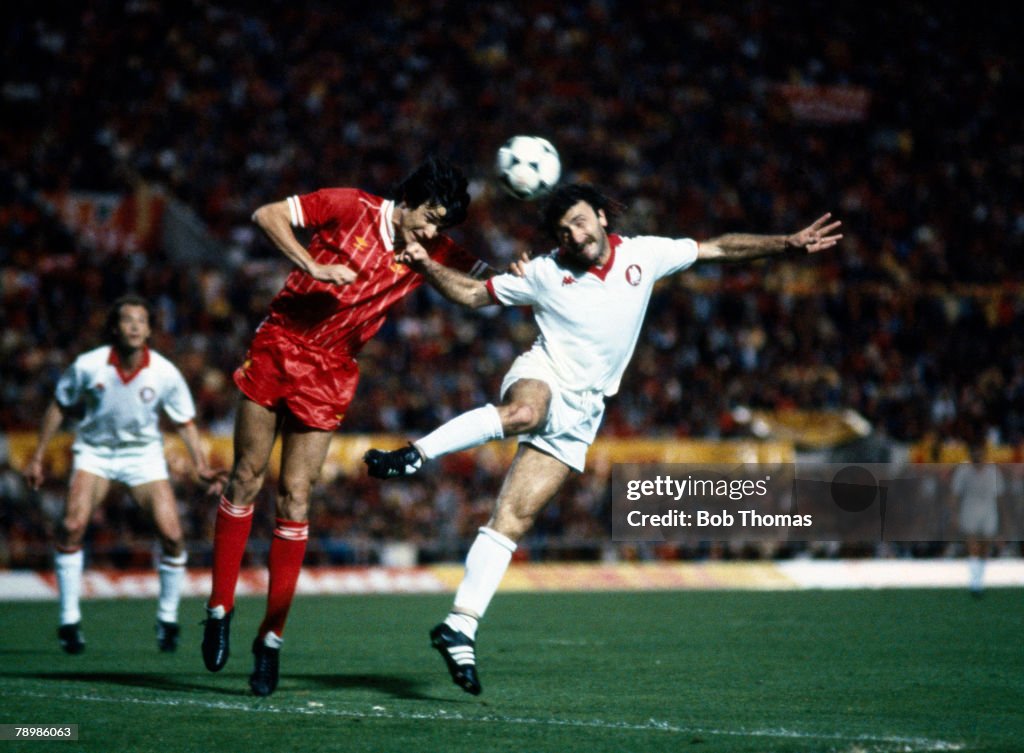 Sport. Football. pic: 30th May 1984. European Cup Final in Rome. Roma 1 v Liverpool 1. after extra time. (Liverpool win 4-2 on penalties). Liverpool's Alan Hansen, left is beaten to a high ball by Roma's Roberto Pruzzo, who scores Roma's goal with a heade