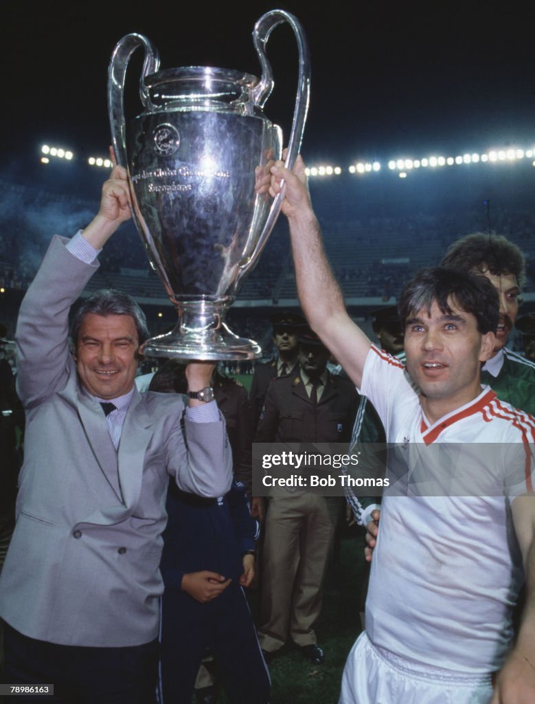 Sport. Football. European Cup Final. Seville. 7th May 1986. Steaua Bucharest 0 v Barcelona 0 ( After Extra Time) Steaua won 2 - 0 on penalties. Bucharest's manager Emeric Jenei and Anghel Iordanescu hold aloft the trophy.