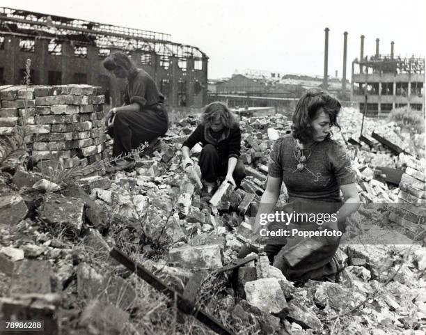 Essen, West Germany Three girls of Essen help to clear the rubble caused by fighting in World War Two
