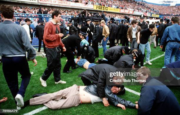 15th April 1989, F.A. Cup Semi-Final at Hillsborough, Liverpool 0,v Nottingham Forest 0, Match Abandoned, Injured fans are treated on the pitch