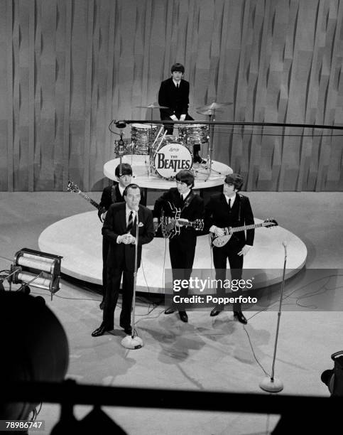 American television host Ed Sullivan introduces The Beatles on their first appearance on 'The Ed Sullivan Show' at CBS Studio 50 in New York City,...