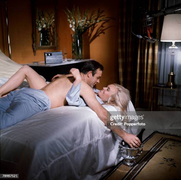 Stage and Screen, Personalities, pic: 1964, Sean Connery playing the James Bond character and Shirley Eaton as Jill Masterson in a love scene from...
