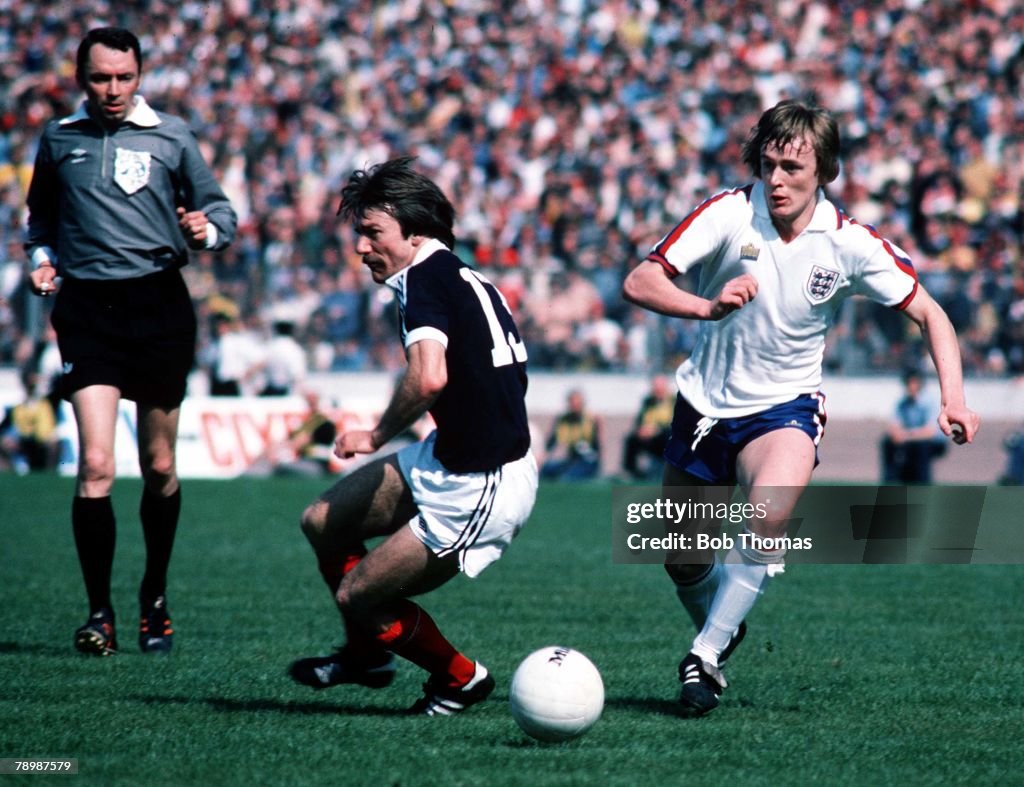 Football. Home Championship. 20th May 1978. Scotland 0 v England 1. Stuart Kennedy of Scotland is pursued by Peter Barnes of England.