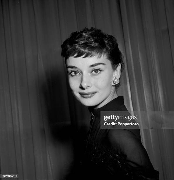 Stage and Screen, Personalities, British actress Audrey Hepburn, born in Belgium, smiling at a welcome home party for her at Claridges Hotel in...