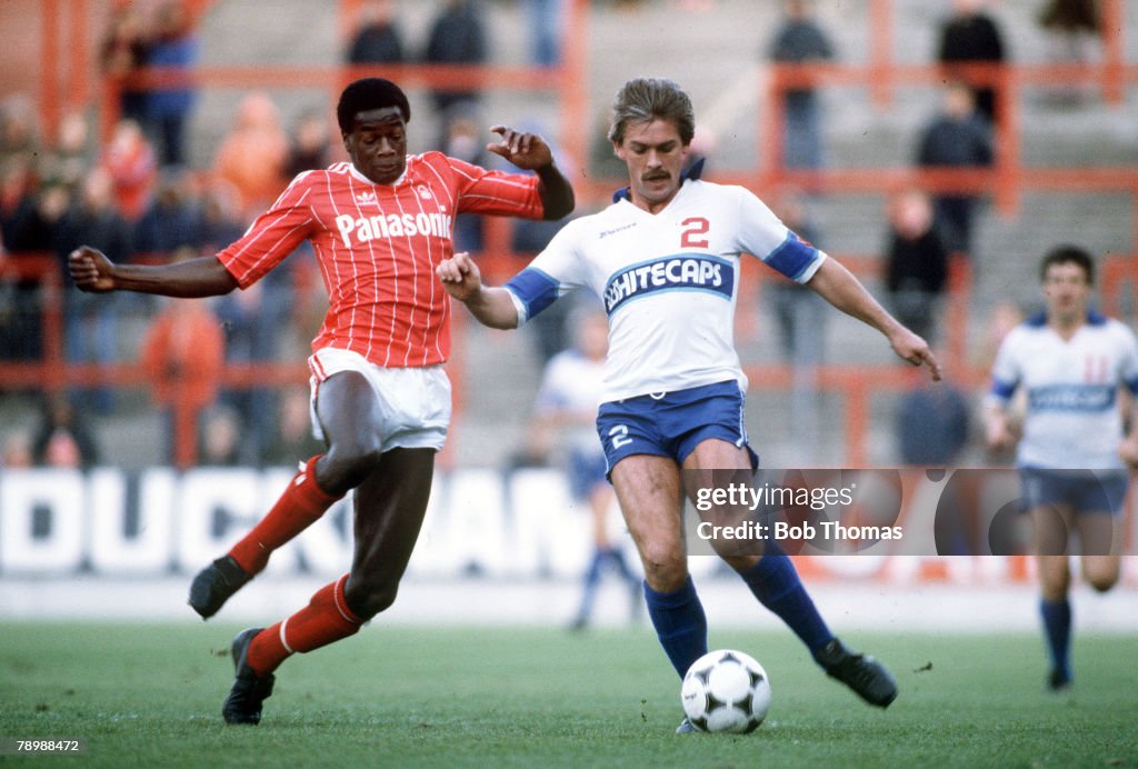 Sport. Football. pic: 11th October 1981. Nottingham Forest's Justin Fashanu rushes in to challenge Vancouver Whitecap's Jimmy Holmes.