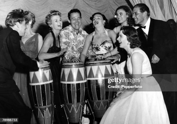 Personalities, Photography, pic:1953, Top photographer Baron, right, pictured at a fashionable night club in Le Touquet, France, as a group enjoy...