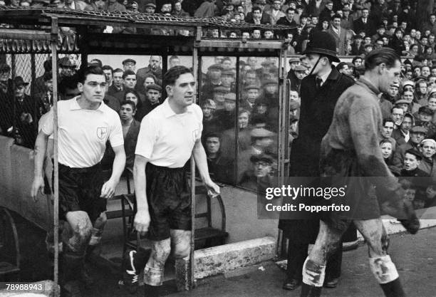 Football, March 1958, Arsenal v Tottenham Hotspur, Spurs players Ted Ditchburn, Danny Blanchflower and Ron Henry emerge from the Highbury tunnel...
