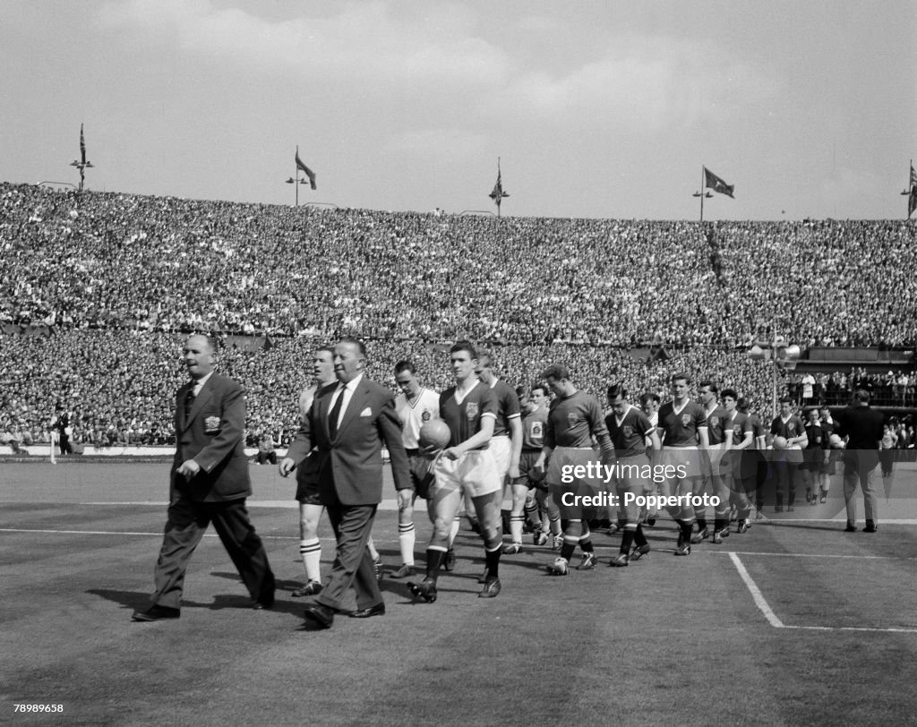 Football. 4th May 1958. Wembley, London. FA Cup Final. Bolton Wanderers 2 v Manchester United 0. The Manchester United Assistant Manager Jimmy Murphy and captain Bill Foulkes lead out the team onto the pitch.