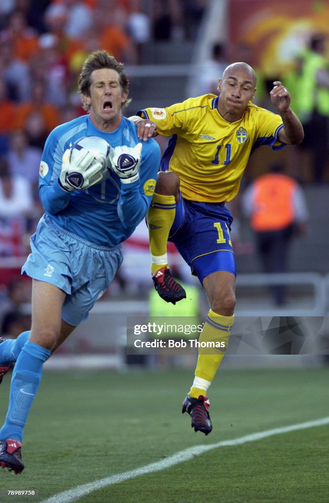 BT Sport. Football. UEFA European Championships. Euro 2004. Algarve, Faro-Loule. 26th June 2004. Quarter Final. Holland 0 v Sweden 0, after extra time. Holland won on penalties. Edwin Van Der Sar of Holland clashes with Henrik Larsson of Sweden.