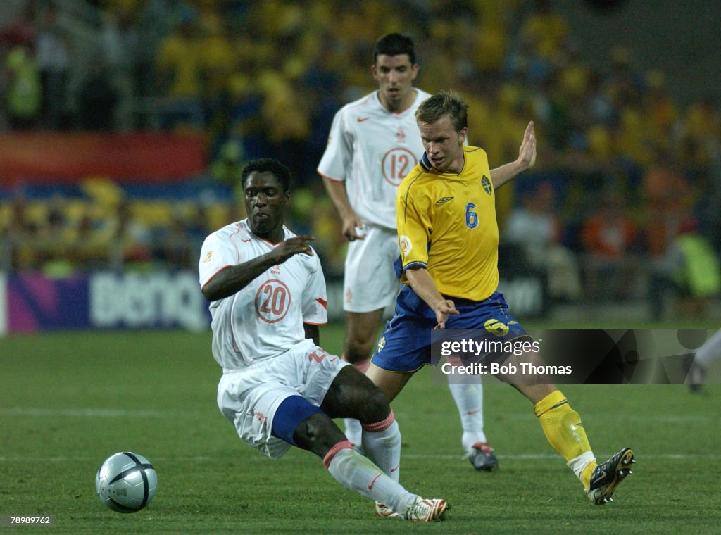 BT Sport. Football. UEFA European Championships. Euro 2004. Algarve, Faro-Loule. 26th June 2004. Quarter Final. Holland 0 v Sweden 0, after extra time. Holland won on penalties. Clarence Seedorf of Holland with Tobias Linderoth of Sweden.