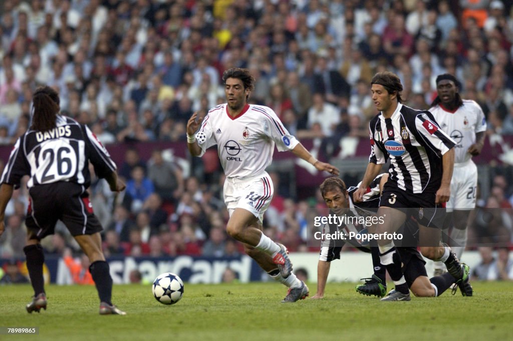 PF Football. UEFA Champions League Final. Manchester, England. 28th May 2003. Juventus 0 v AC Milan 0. Milan won 3 - 2 on penalties. Rui Costa of AC Milan watched by Alessio Tacchinardi of Juventus ( right).