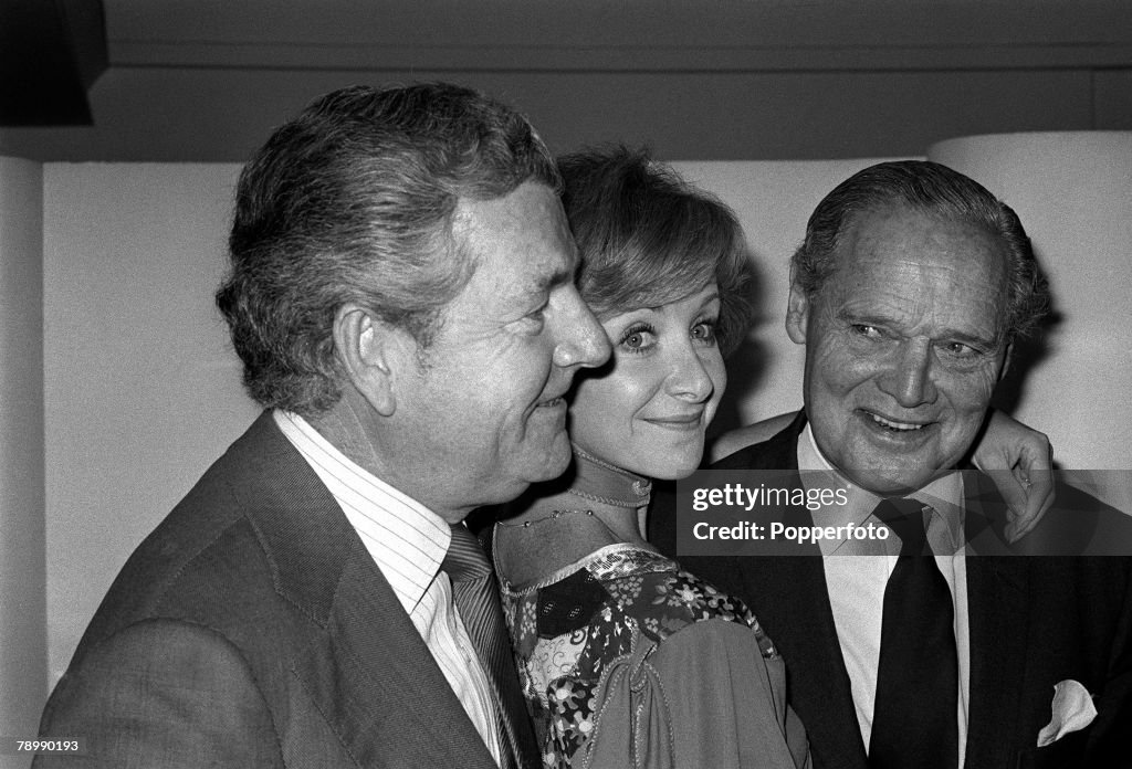 Personalities. pic: October 1975. British actor Kenneth More, left, his wife Angela Douglas and World War II fighter pilot Douglas Bader at a London show business lunch.