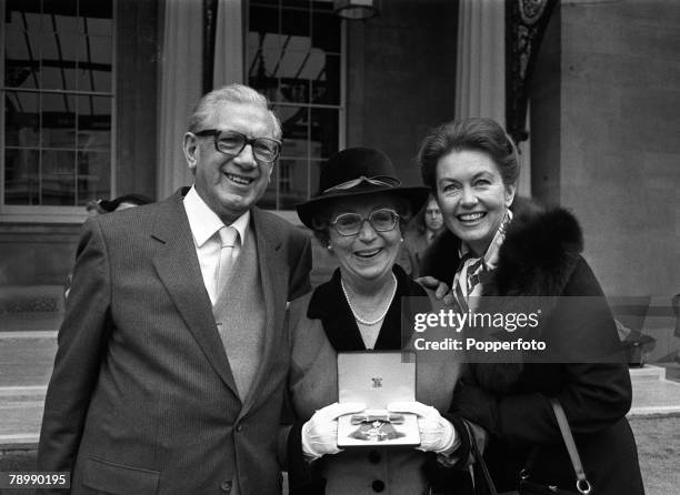 Television Personalities, pic: 1st November 1983, English actress Thora Hird, centre, pictured at Buckingham Palace with her husband James and...