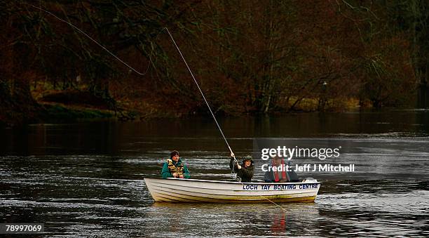 Fiona Armstrong, helps anglers mark the opening of the salmon fishing season on the River Tay at Kenmore January 15, 2008 in Kenmore, Scotland. New...
