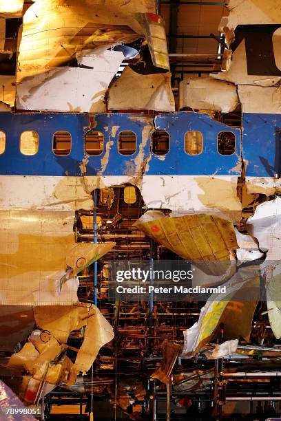 Damage to the fuselage of Pan Am flight 103 shows where the initial blast took place on January 15, 2008 in Farnborough, England. The Air Accident...