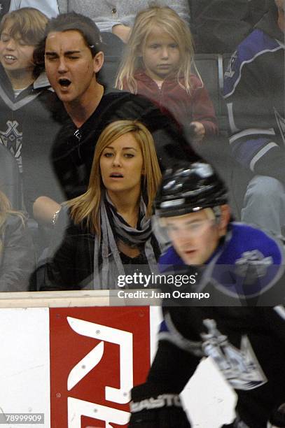 Dieter Schmitz of the MTV show "Laguna Beach" and Lauren Conrad of "The Hills", watch as Patrick O'Sullivan of the Los Angeles Kings skates by during...