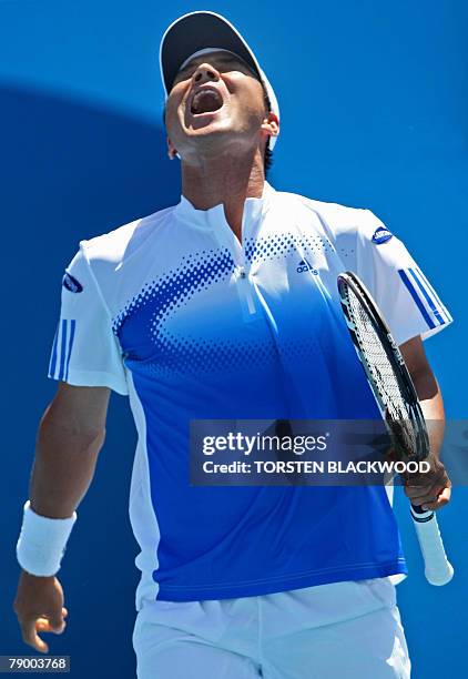 South Korean tennis player Lee Hyung-Taik reacts during his mens singles match against Australian opponent Chris Guccione at the Australian Open...