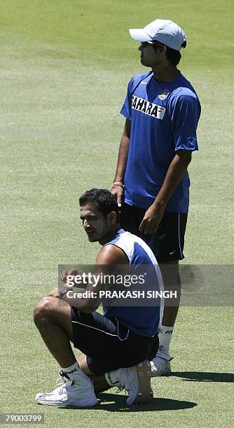 India's Irfan Pathan and Rudra Pratap Singh rest during a training session at the WACA stadium in Perth, 15 January 2008. India will play third test...