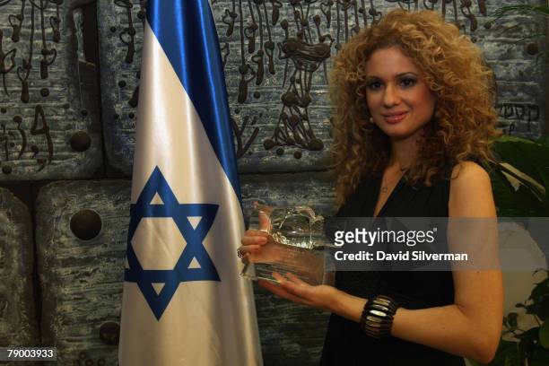 Grammy Award-winning musician Miri Ben-Ari holds the Martin Luther King Jr. Israel Award which she received for her outreach to the African-American...