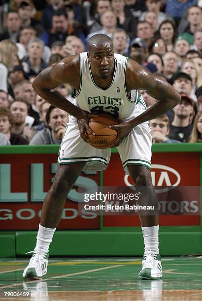Kendrick Perkins of the Boston Celtics grabs a rebound against the Orlando Magic on December 23, 2007 during the game at the TD Banknorth Garden in...