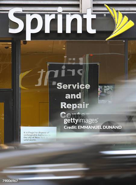 Car drives past a shop offering Sprint Nextel mobile phone service in New York, 15 January 2008. The Wall Street Journal reported 15 January that...