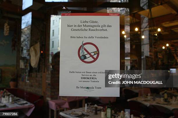 Italian restaurant A Muntagnola sports a no-smoking sign on the entrance door in Berlin 15 January 2008. The restaurants runs the so-called Smokeria,...