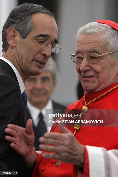 Guatemala's Cardinal Rodolfo Quezada gestures as Guatemala's new President Alvaro Colom looks on during a Te Deum mass at Guatemala's Metropolitan...