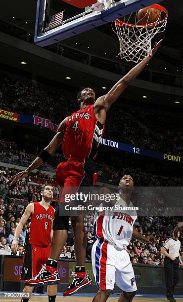 Chris Bosh of the Toronto Raptors grabs a rebound in front of Chauncey Billups of the Detroit Pistons on January 15, 2008 at the Palace of Auburn...