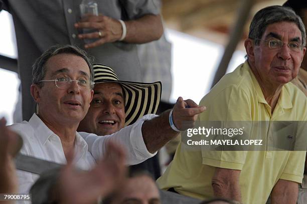 Colombian president, Alvaro Uribe , PANACA president, Jorge Ballen and Costa Rican president, Oscar Arias , admire an equestrian exhibition at the...