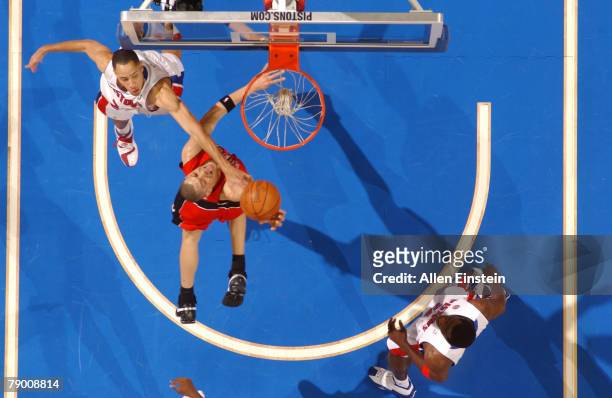 Anthony Parker of the Toronto Raptors tries a layup against Tayshaun Prince of the Detroit Pistons on January 15, 2008 at the Palace of Auburn Hills...