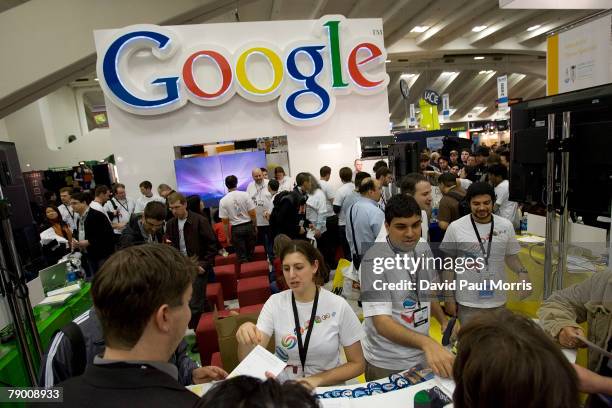 People look over the Google booth at the 2008 Macworld at the Moscone Center January 15, 2008 in San Francisco, California. The annual conference and...