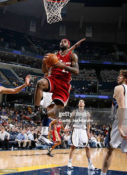 LeBron James of the Cleveland Cavaliers drives to the basket past Pau Gasol of the Memphis Grizzlies on January 15, 2008 at the FedExForum in...