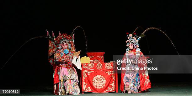 Students from the Peking Opera Department of the Jilin College of the Arts, perform Peking Opera "Fortified Village Muke" on January 14, 2008 in...