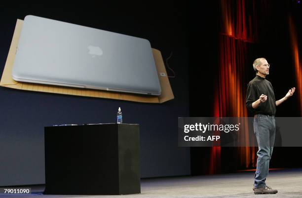 Apple CEO and co-founder Steve Jobs shows off the new Macbook Air ultra portable laptop during his keynote speech at the MacWorld Conference & Expo...