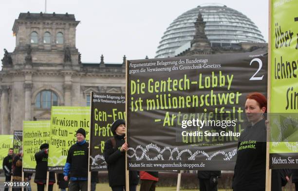 Protesters from the civic initiative compact.de protest against genetically-modified foods in front of the Bundestag January 16, 2008 in Berlin,...