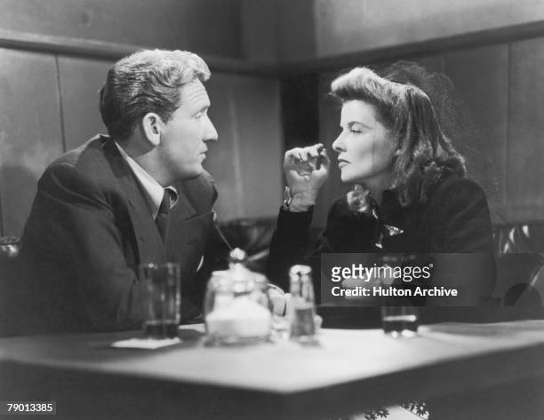 American actors Spencer Tracy , as Sam Craig, and Katharine Hepburn , as Tess Harding in a scene from 'Woman Of The Year', their first film together,...
