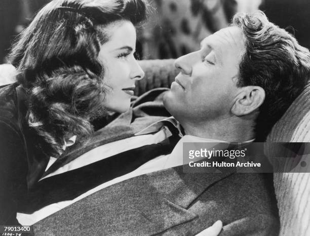 American actors Spencer Tracy , as Sam Craig, and Katharine Hepburn , as Tess Harding in a scene from 'Woman Of The Year', their first film together,...