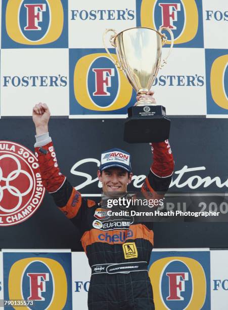 Mark Webber of Australia, driver of the European Arrows F3000 Team Lola T99/50-Zytek holds the trophy after winning the FIA International Formula...