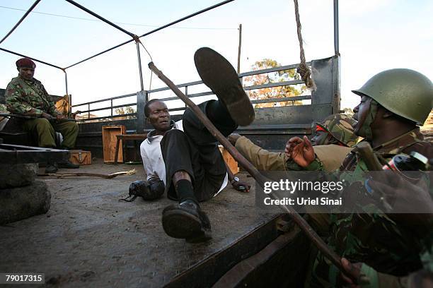 Kenyan soldiers hit a resident during clashes in the Mathari slums on January 16, 2008 in Nairobi, Kenya. International mediators have attempted to...