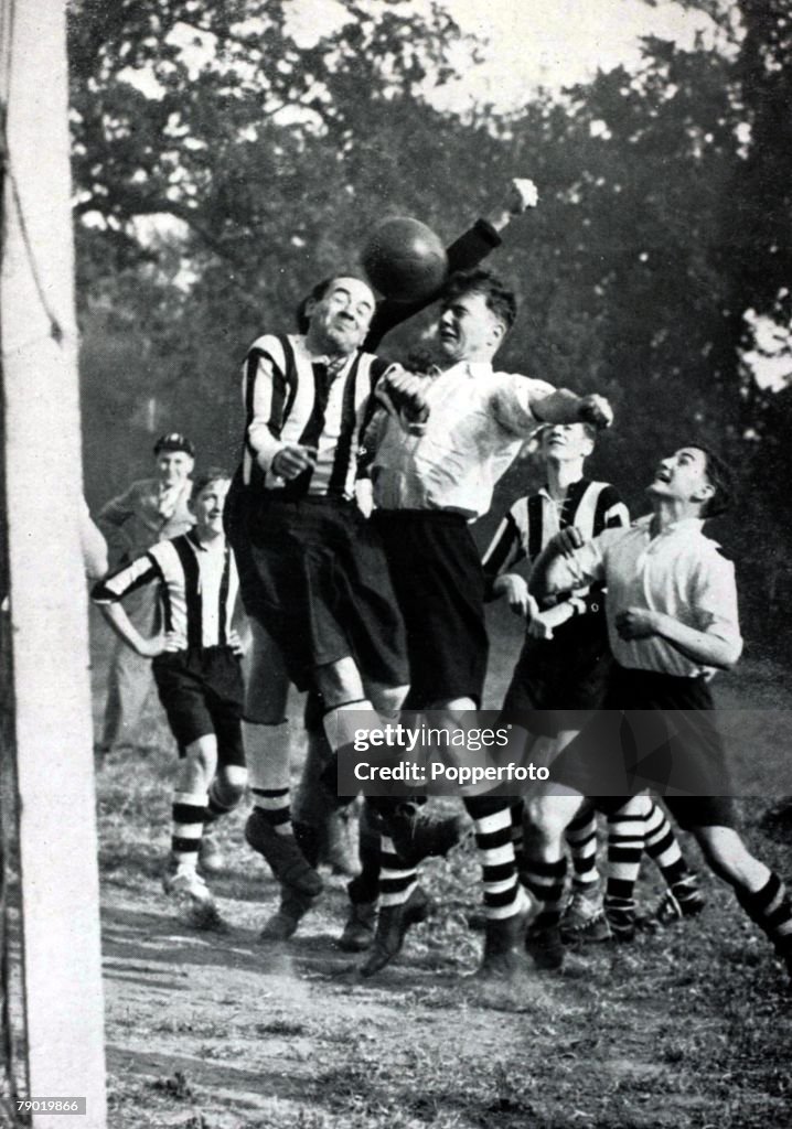 Sport. Football. Alex James, former Arsenal and Scotland star, in his trademark baggy shorts, at Friern Barnet Grammar School school to play in a schoolboy game. October 1939.