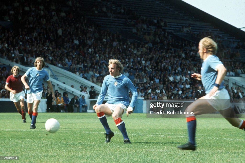 Football. 18th August, 1973. Manchester City's L-R: Colin Bell, Denis Law and Francis Lee watch the ball during a league match.