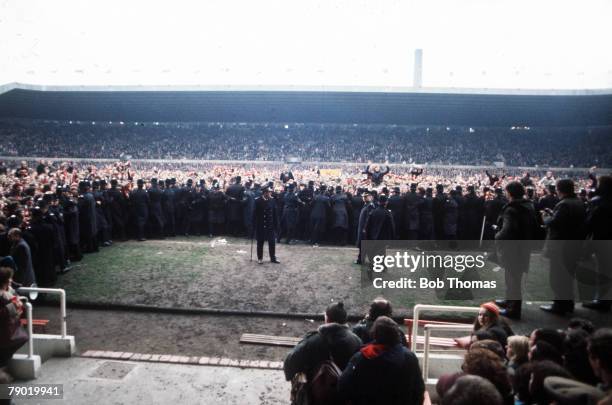Football Old Trafford, Manchester United' fans invade the pitch as they celebrate their team's promotion to the First Division following a season in...