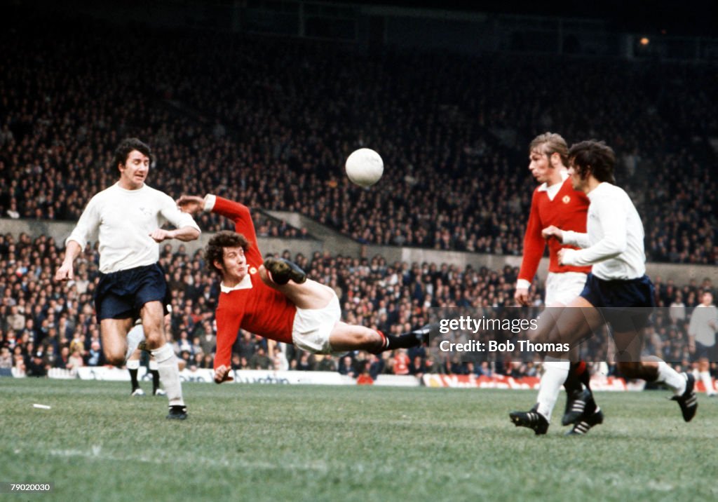 Football. 13th October, 1973. Manchester United+s Brian Kidd tries a spectacular scissors kick at the Derby county goal during their match at old Trafford.