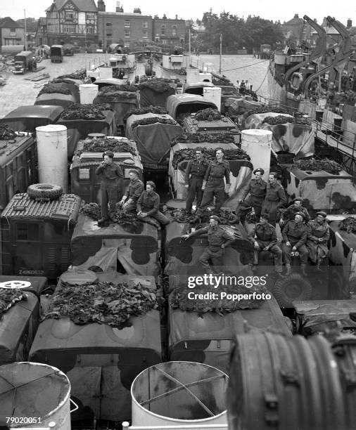 World War II England, Allied Liberation of Europe, and the build up to D-Day, The Invasion of France, As D-Day nears, equipment, including trucks,...