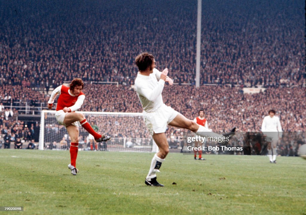 Football. 1972 FA Cup Final. Wembley Stadium. 6th May, 1972. Leeds United 1 v Arsenal 0. Arsenal's Alan Ball shoots past the challenge of a Leeds player.