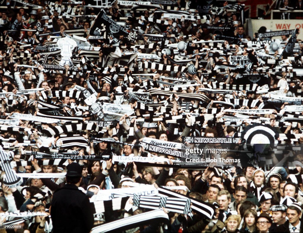 Football. 1974 FA Cup Final. Wembley Stadium. 4th May, 1974. Liverpool 3 v Newcastle United 0. A huge crowd of Necastle fans cheer on their team, waving scarves and banners.