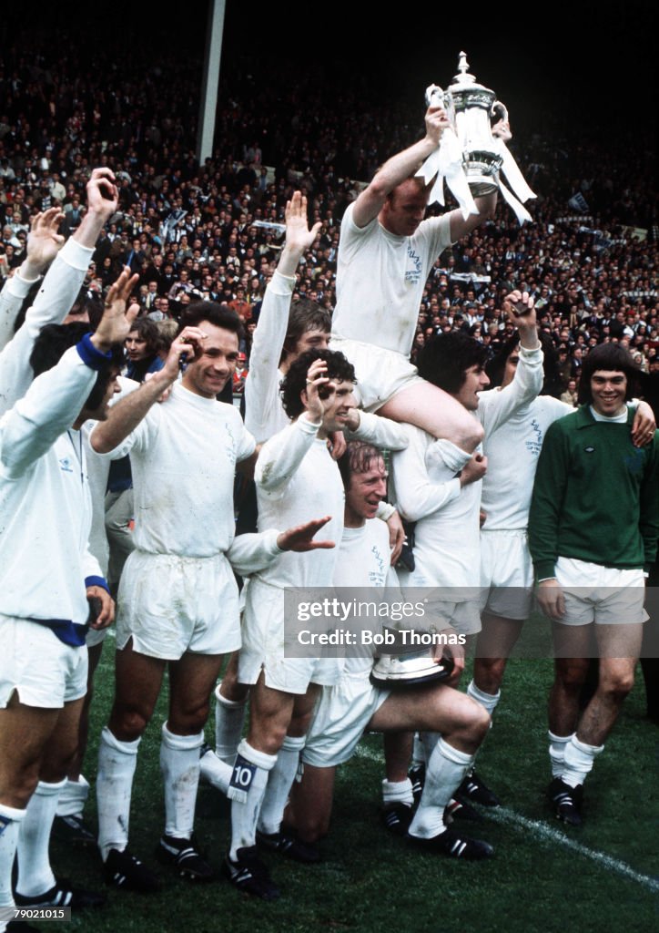 Football. 1972 FA Cup Final. Wembley Stadium. 6th May, 1972. Leeds United 1 v Arsenal 0. Leeds United captain Billy Bremner is lifted onto the shoulders of his teammmates as he proudly holds aloft the FA Cup trophy after their win.