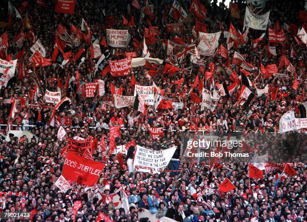 Football, 1977 FA Cup Final, Wembley, Manchester United 2 v Liverpool 1, 21st May A crowd of Manchester United fans waving flags and banners to cheer...