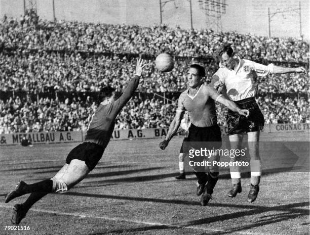 World Cup Finals, Quarter Final tie, Basle, 26th June 1954, England v Uruguay England forward Tom Finney, far right, jumps for a header with Uruguay...