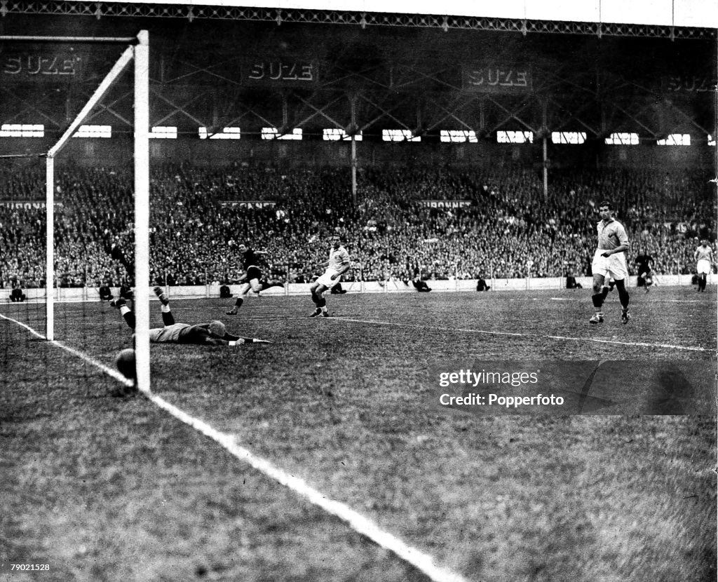 1938 World Cup Finals. Quarter Final tie. Colombes Stadium, Paris. 12th June 1938. France.1. v Italy.3. Italy's second goal is scored by Silvio Piola, far left, as France goalkeeper Di Lorto lies beaten.
